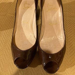 Louboutin peep toe block heels. Lots of love left!